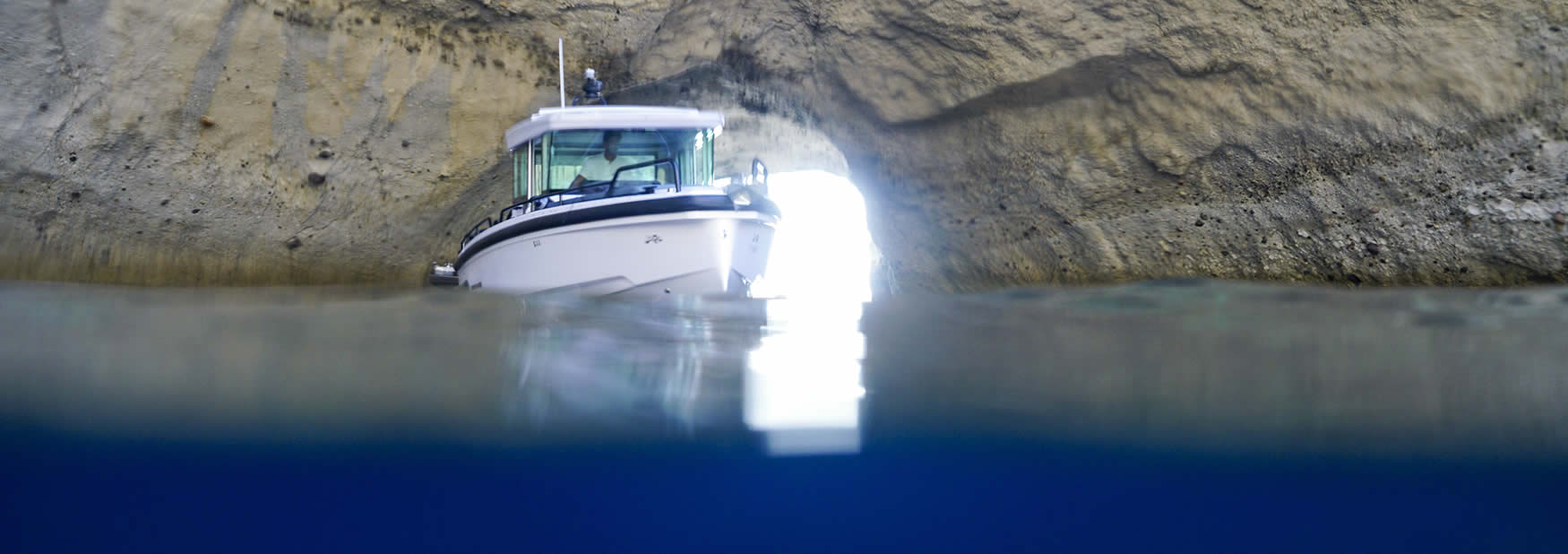 Boat rental based in Milos island. The sea pig is actually an Axopar 28 with Cabin.